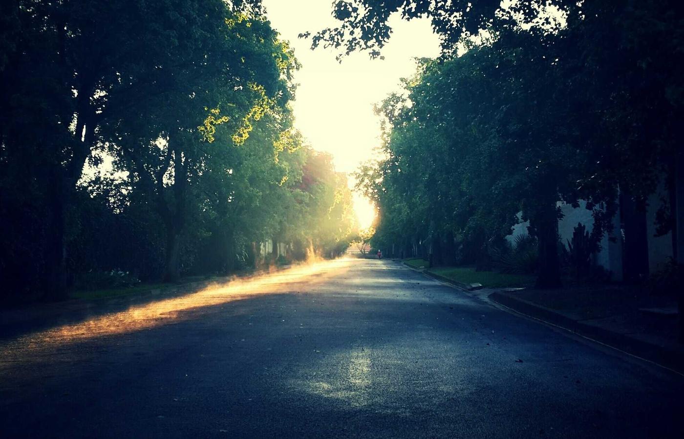 A home care worker assisting an elderly person with a friendly smile.