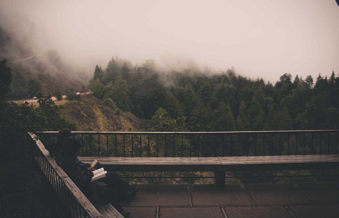 A diverse team discussing plans around a large table.